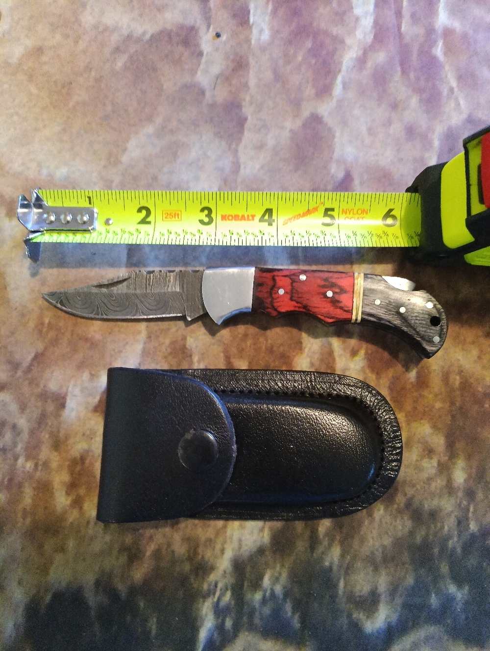 Damascus Steel Pocket Knife With Pekka Wood Red/Gray Handle And Leather Sheath.